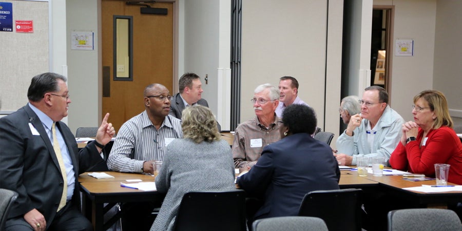TASB members at the grassroots meeting with intense discussion.