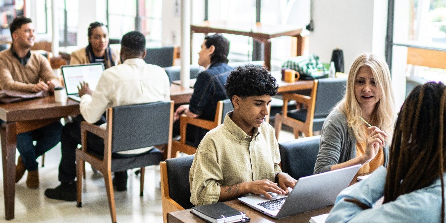 People studying and meeting in library